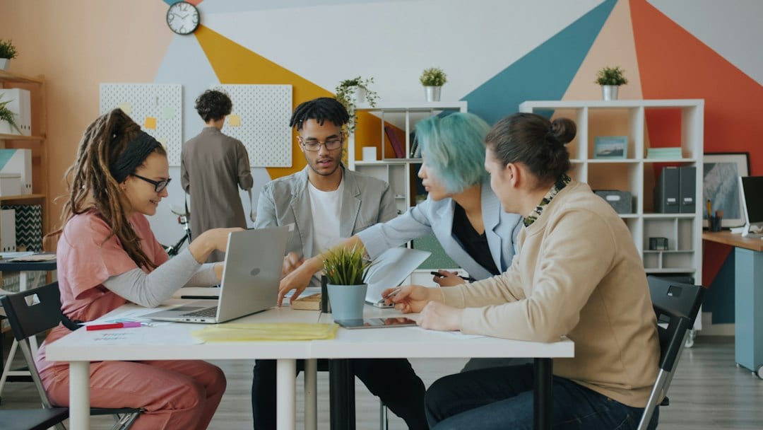 A diverse group of people collaborating around a table in a modern office